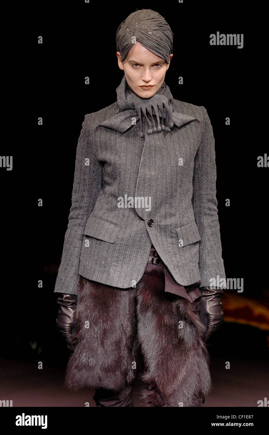 Underover Paris Ready to Wear Autumn Winter Grey pinstriped jacket single button worn over brown fur outfit, leather gloves and Stock Photo