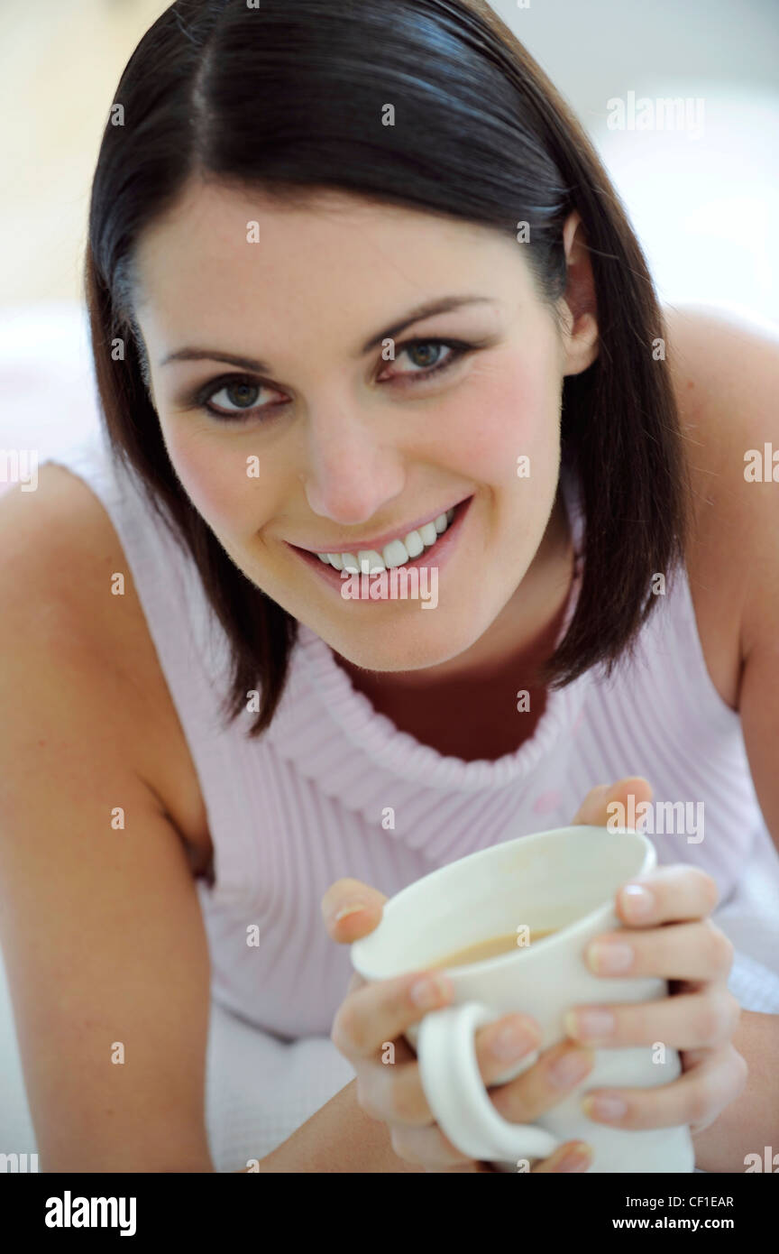 Female Short Brunette Hair And Dark Eye Make Up Wearing Pale