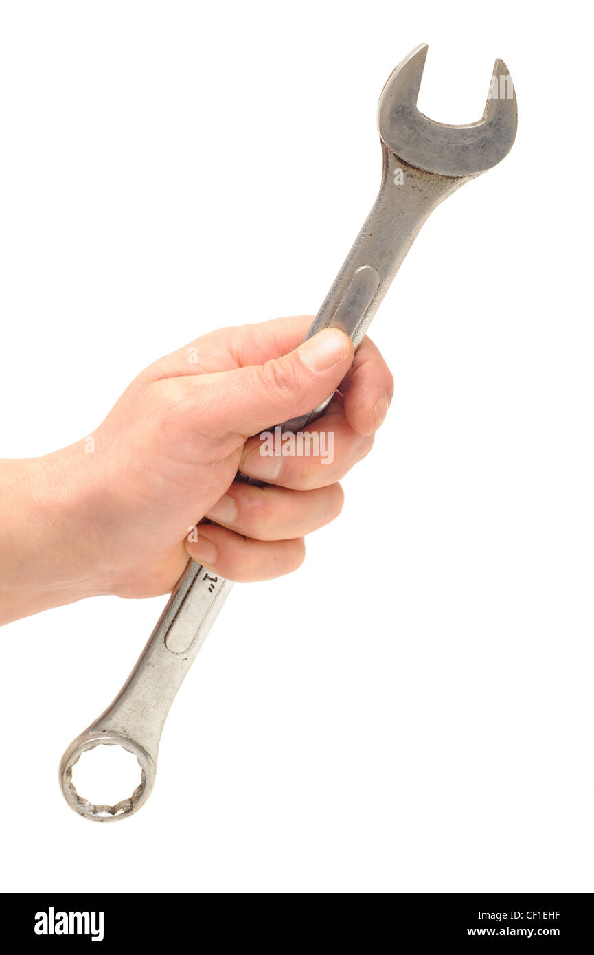 Hand holding a metal spanner Stock Photo