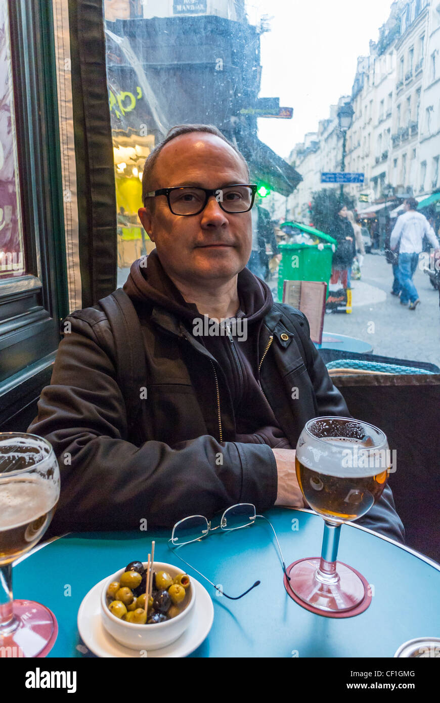 Paris, Cafe, France, Man Sitting in Local French "Café du Centre" in the District