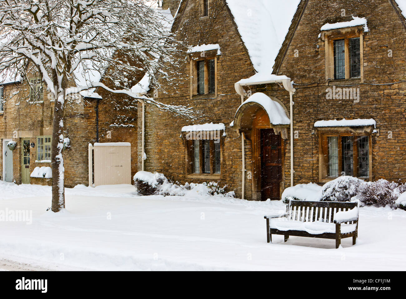 Snow falling in the Cotswold village of South Cerney. Stock Photo