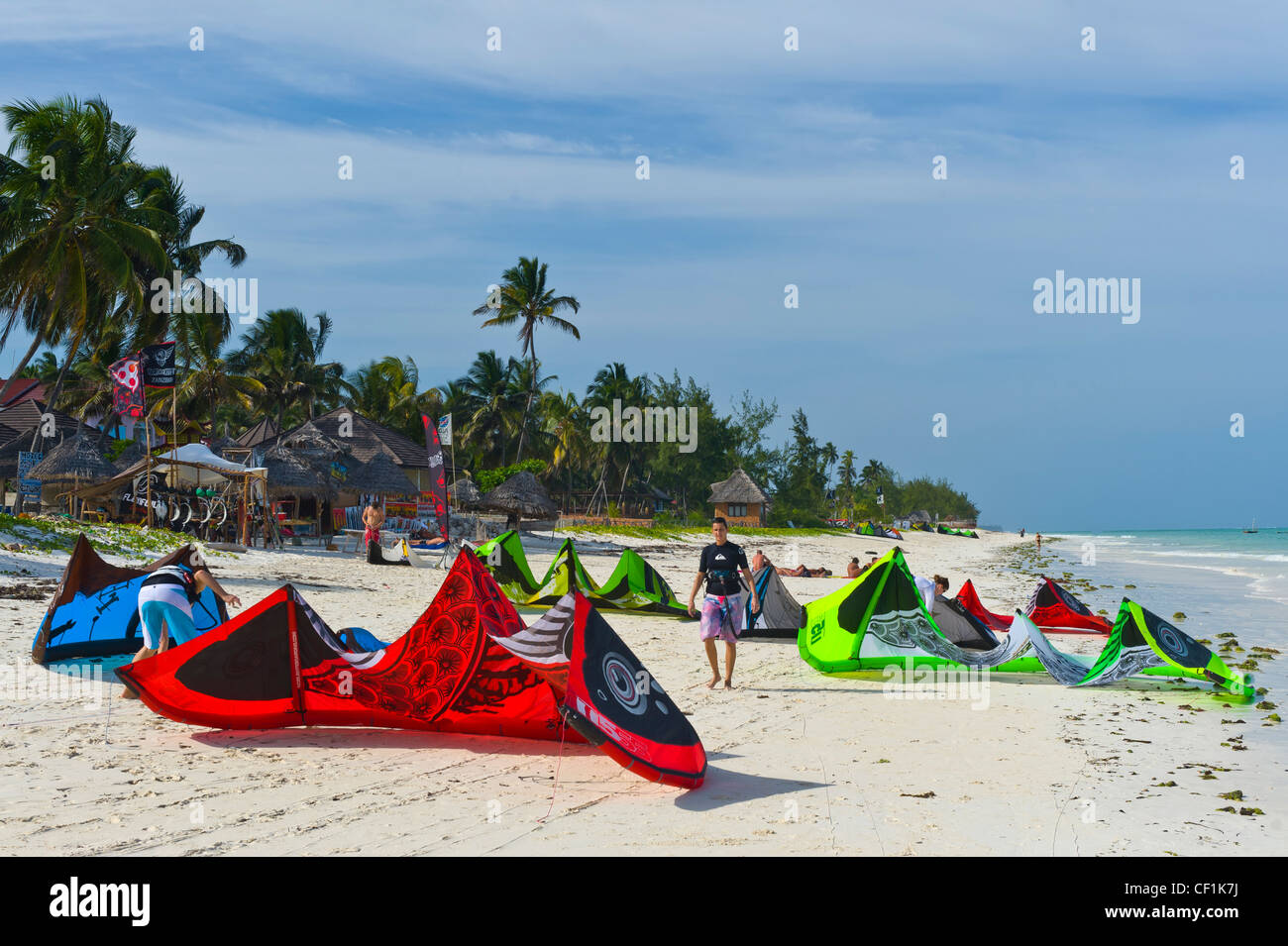 Kite surfers prepare their kites for launching in Paje, Zanzibar, Tanzania Stock Photo