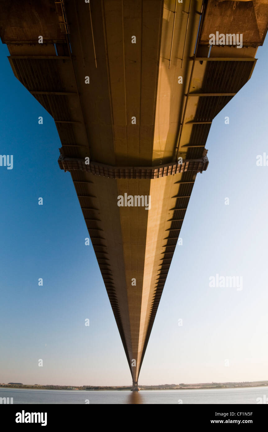 Autumn sunset under the Humber Bridge the fifth-largest single-span suspension bridge in the world. Stock Photo