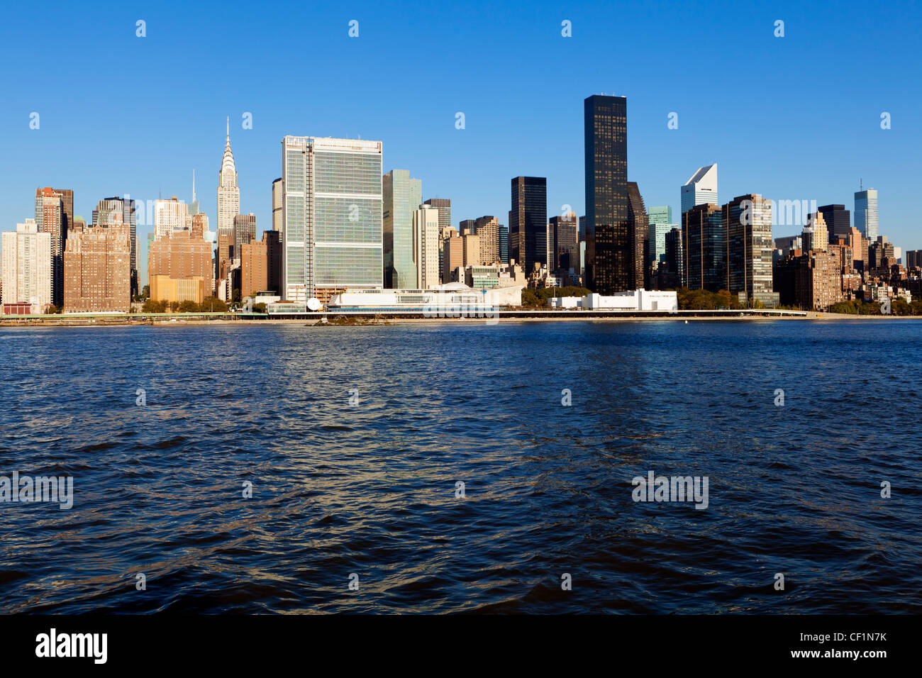 Skyline of Midtown Manhattan seen from the East River showing the ...