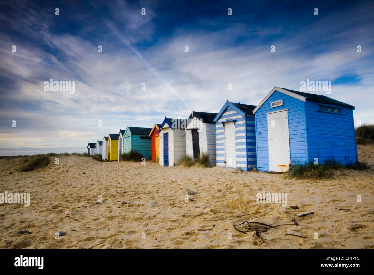 Beach huts at Southwold. The town has 300 beach huts which evolved from fishermen's huts and bathing huts, from where they progr Stock Photo