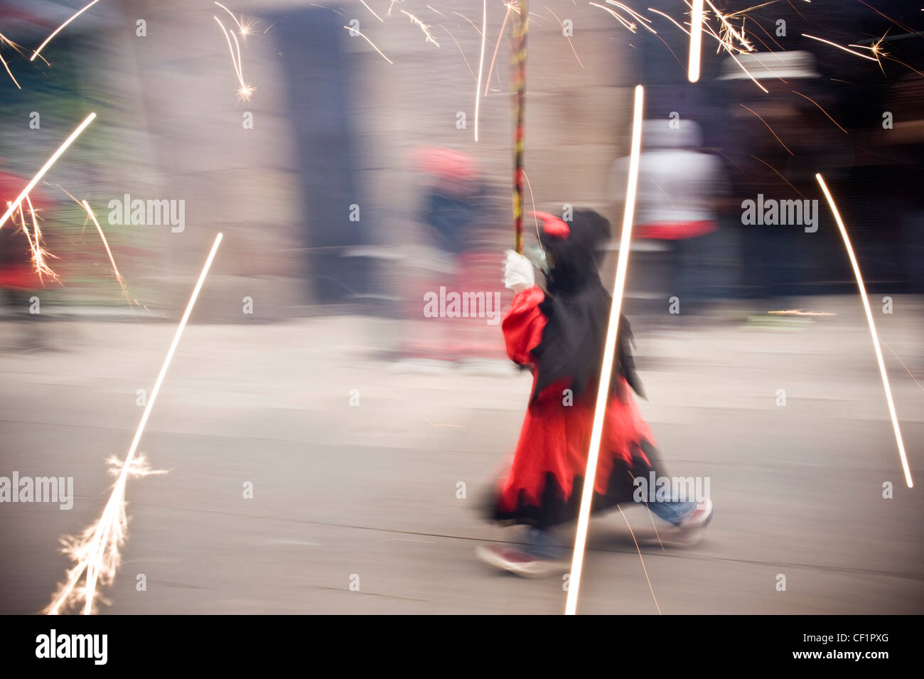 Fireworks and young devil on traditional Correfoc during a typical ...