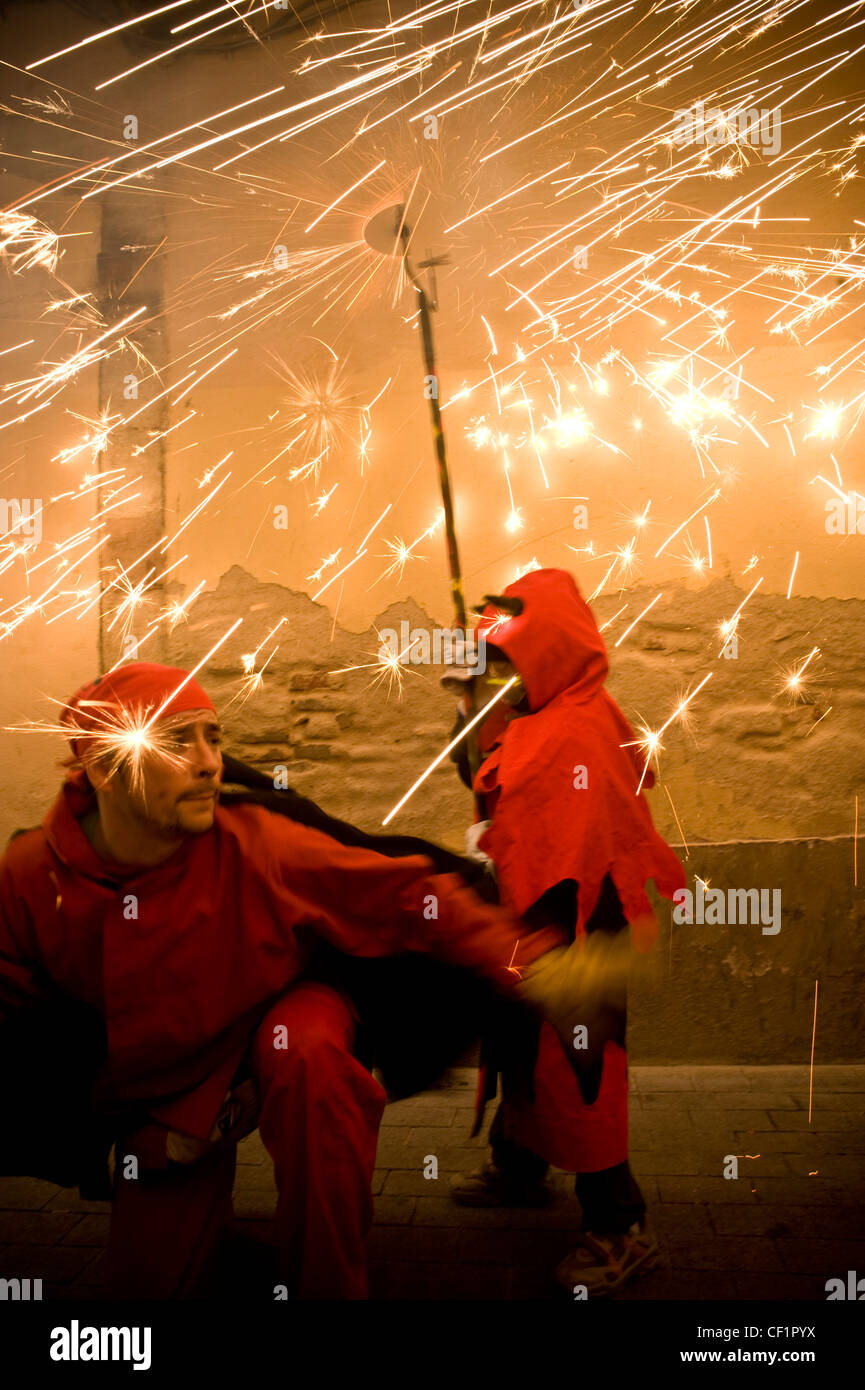 Fireworks and a young devil on traditional Correfoc during a typical ...