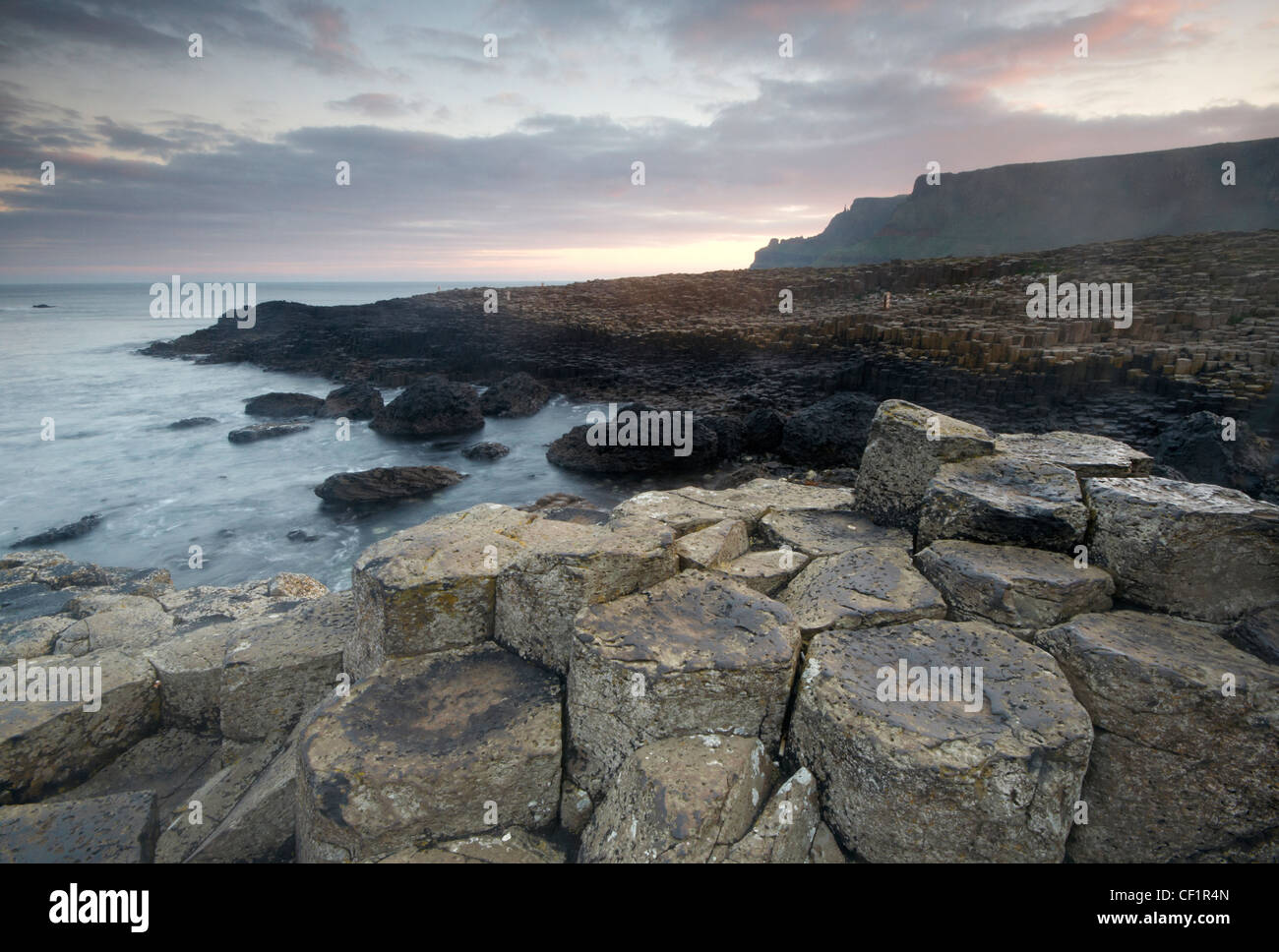 Interlocking basalt columns of the Giants Causeway, named as the fourth natural wonder in the UK, County Antrim. Stock Photo