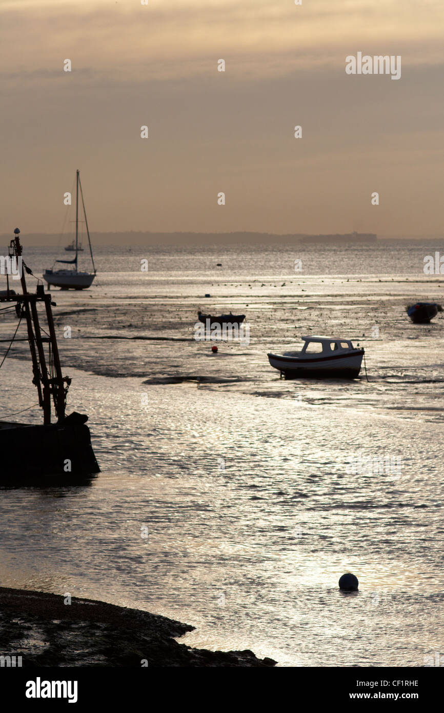 Small boats moored in the estuary at Leigh-on-Sea in Essex. Stock Photo