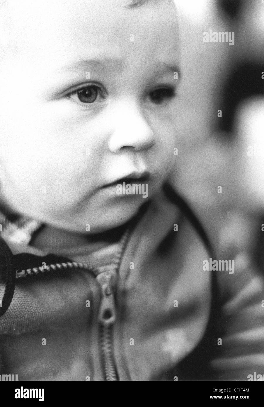 'FACES OF ALFI' Baby with serious expression Stock Photo