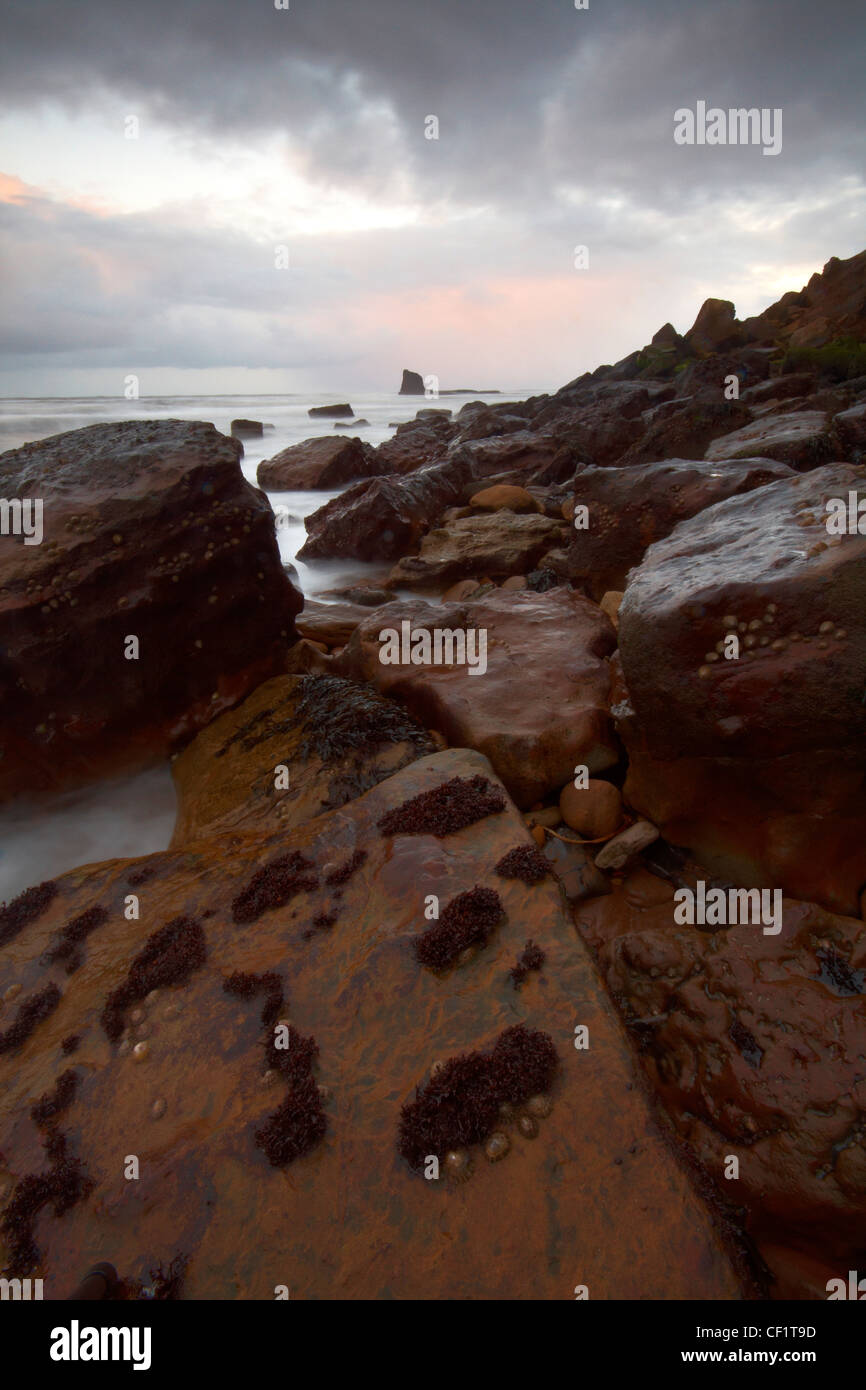 The rocky coastline of Saltwick Bay. Stock Photo