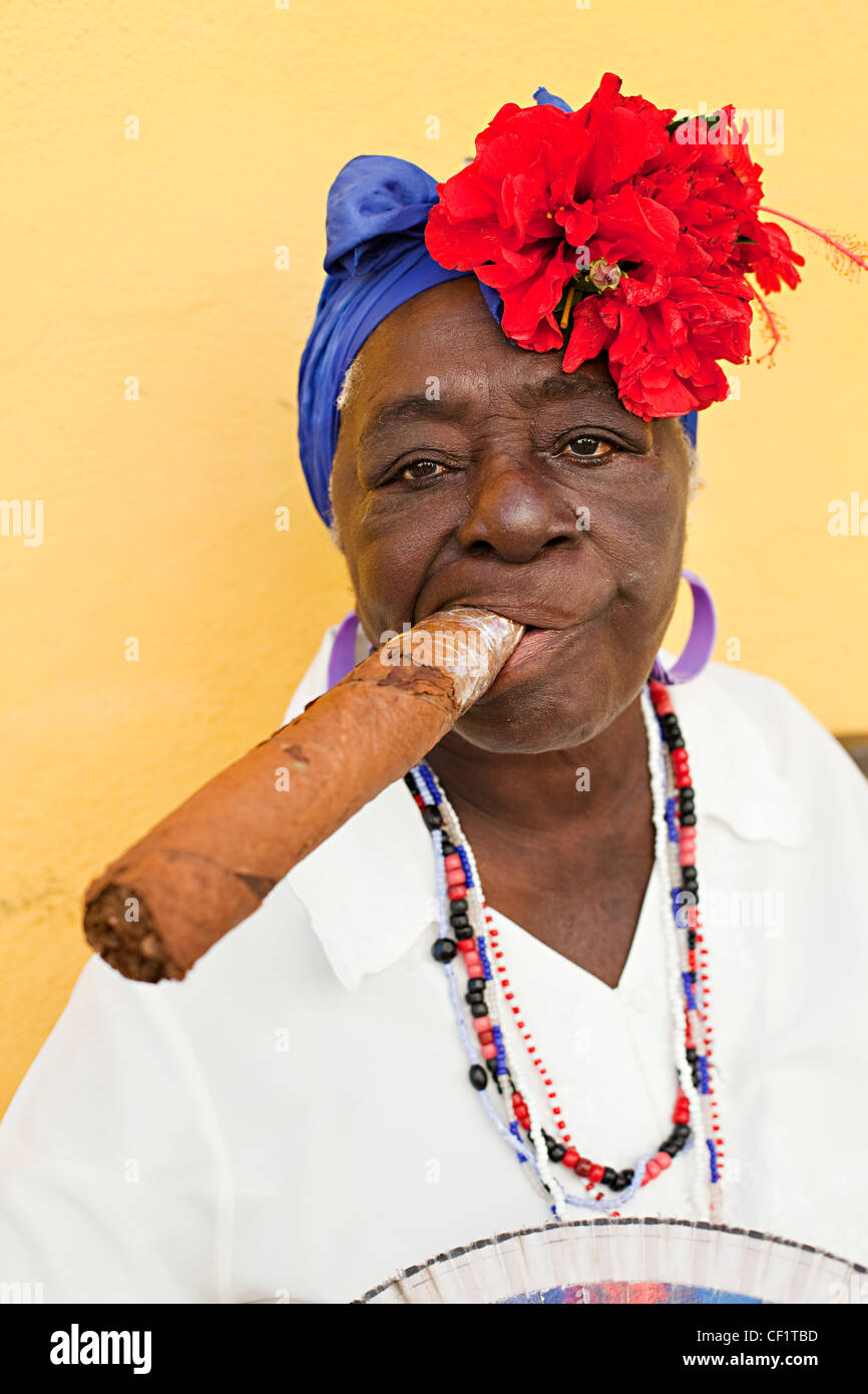 Portrait of an elderly lady in Havana with a huge cigar in her mouth Stock Photo