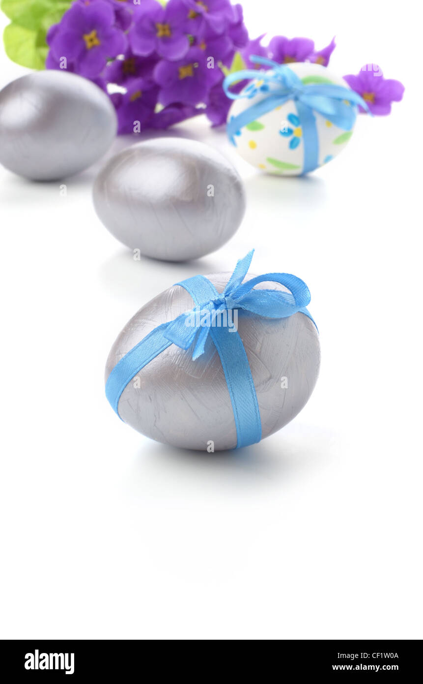 Easter eggs with bows over white background Stock Photo - Alamy