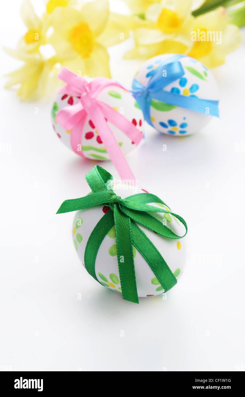 Easter eggs with bows over white background Stock Photo - Alamy