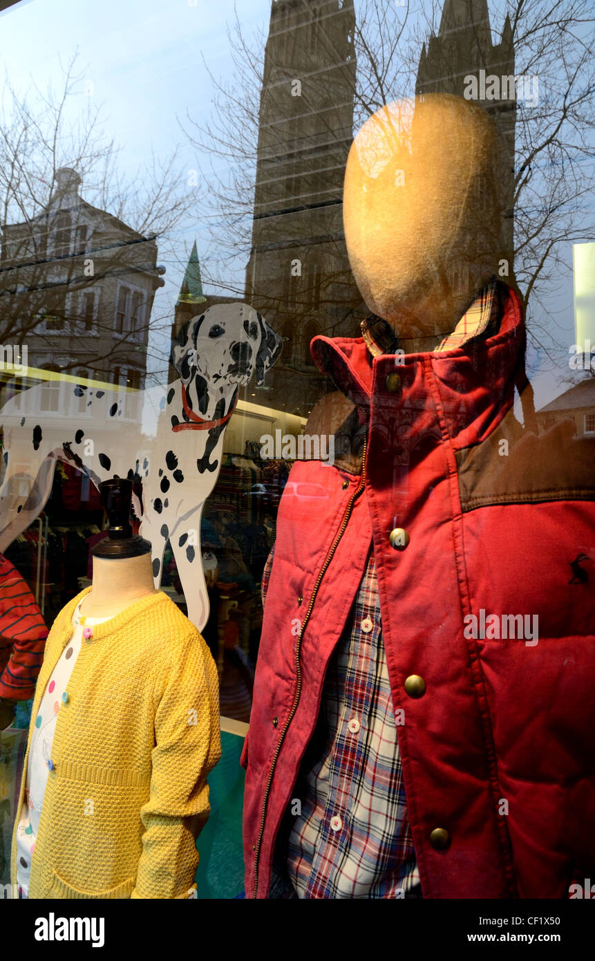 Refection of newly restored Truro Cathedral in Joules Shop window Stock Photo