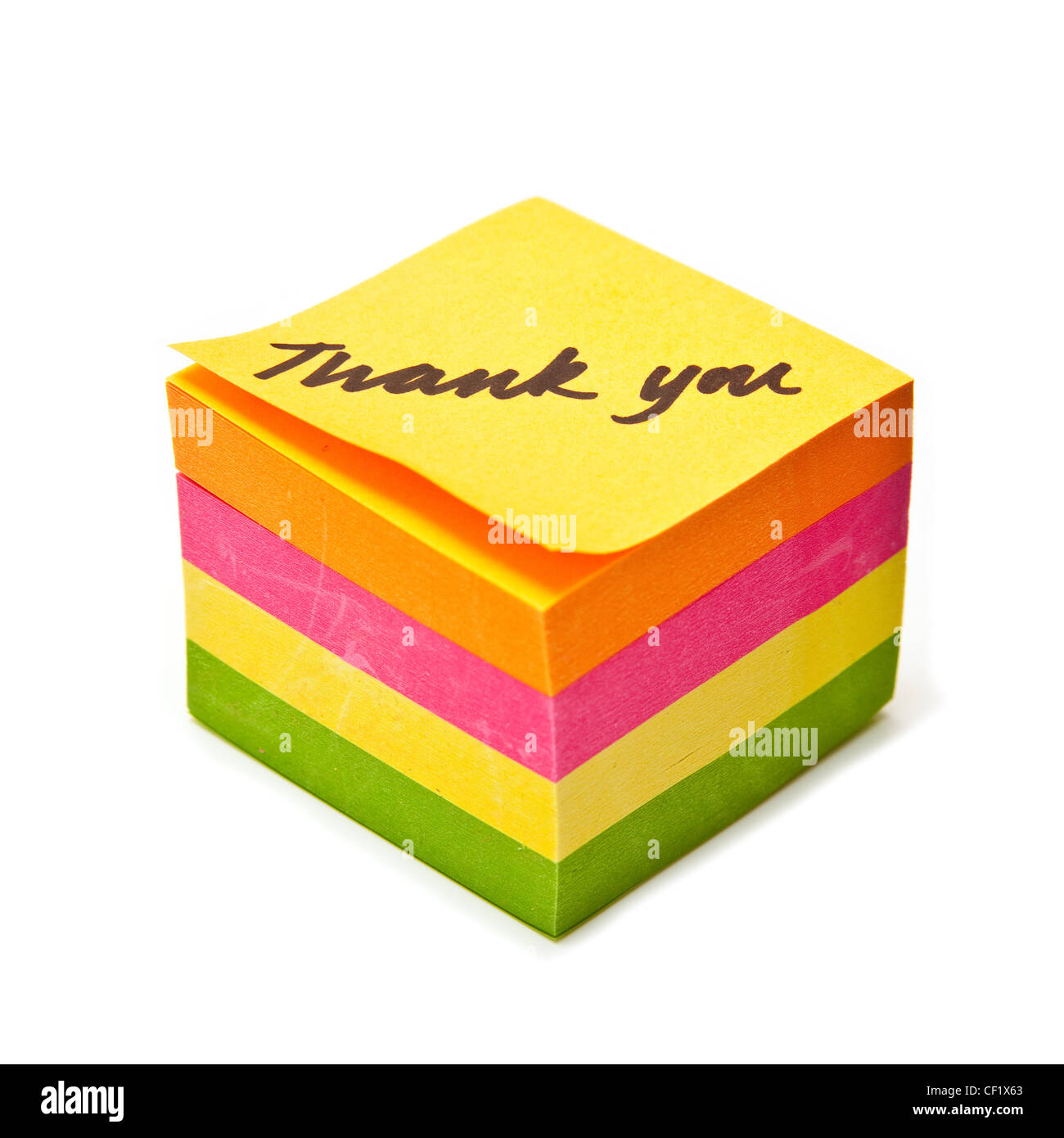 Thank you note written on a sticky note pad isolated on a white studio