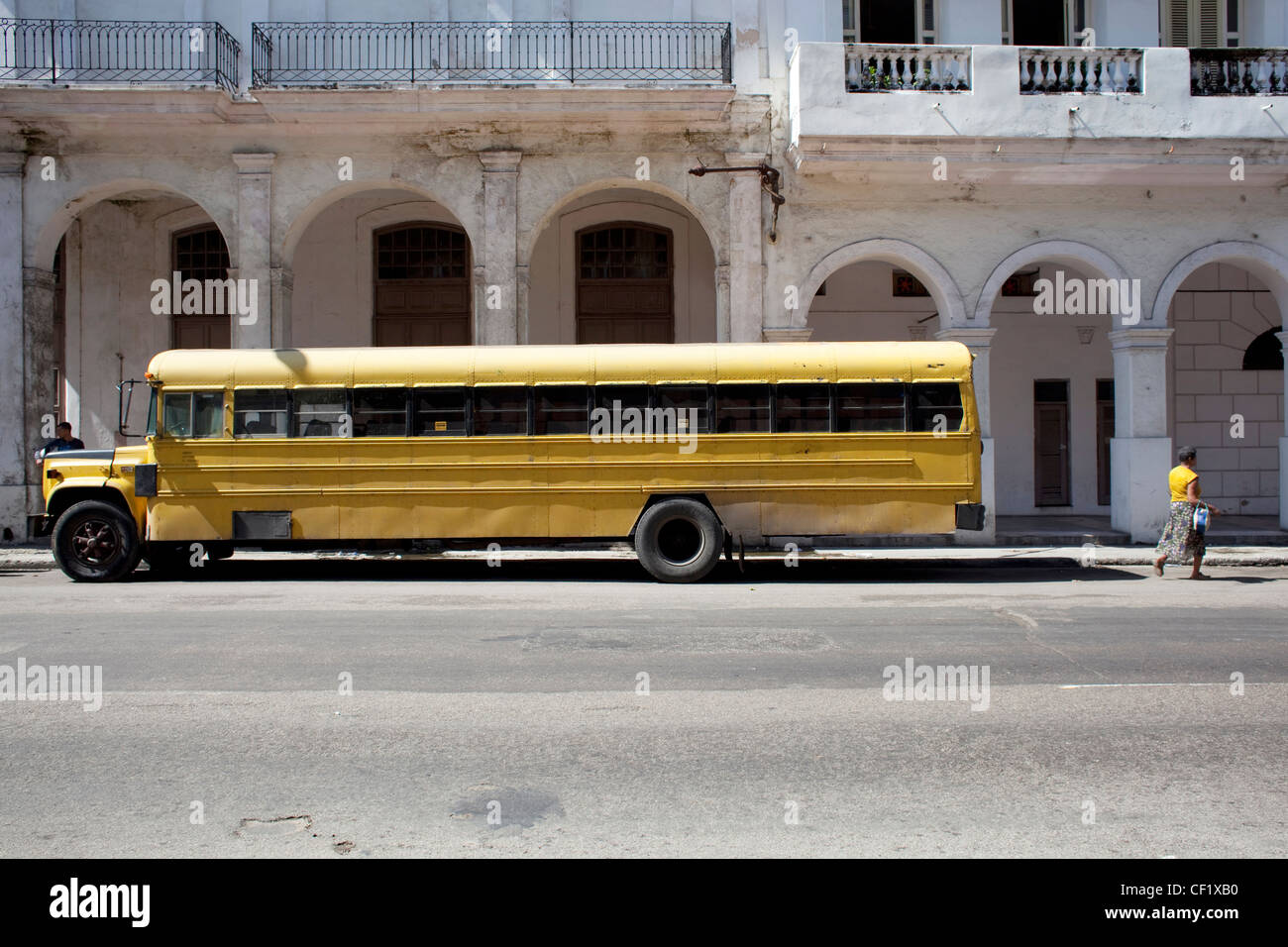 Yellow school bus parked on the street in Havana, Cuba Stock Photo