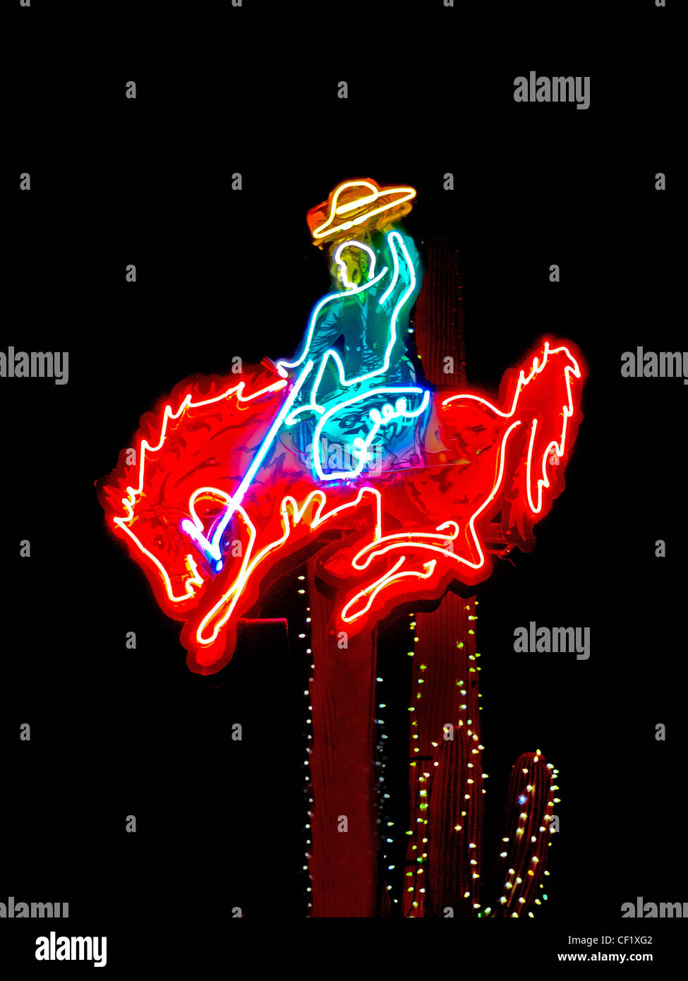 A neon sign of a cowboy on a bucking bronco decorates a restaurant in Tucson, AZ. Stock Photo