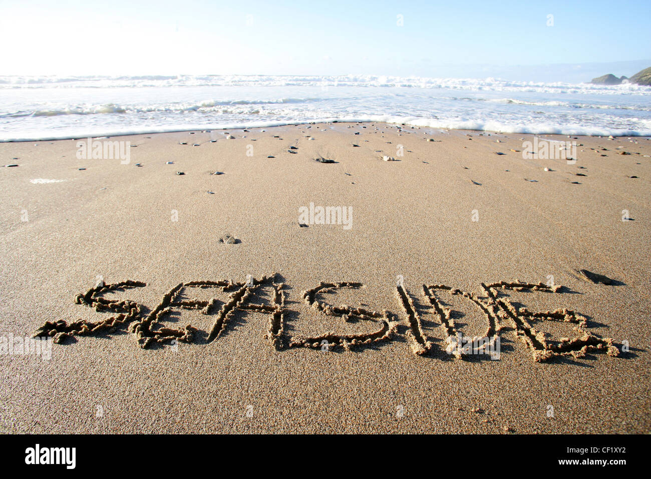 Writing in the sand at Praa Sands. A huge sandy beach popular with