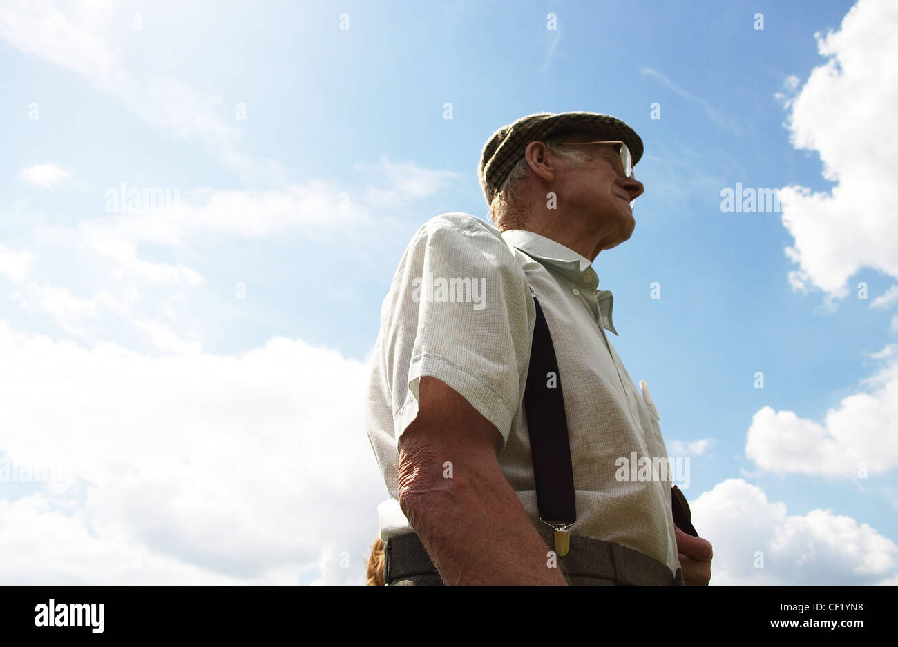 flat cap, glasses, white striped shirt 