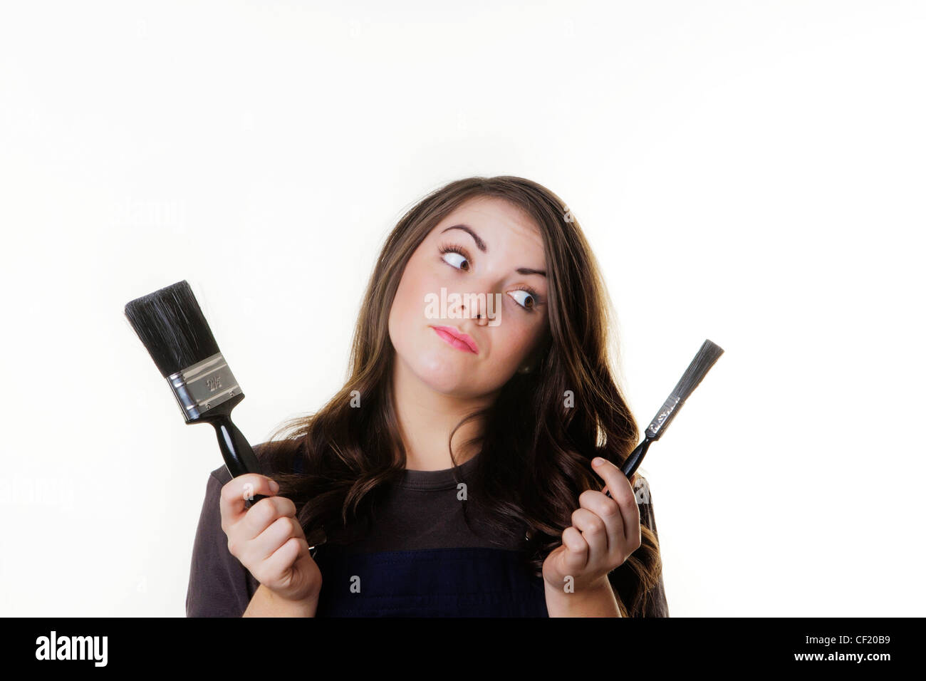 young woman with paint brush in hand Stock Photo Alamy