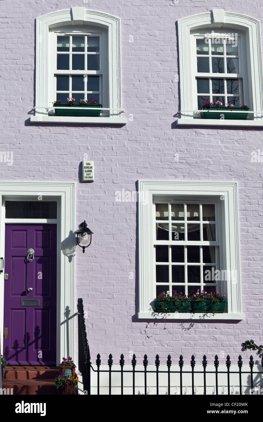 The exterior of a lilac painted terrace house in Bywater Street Stock