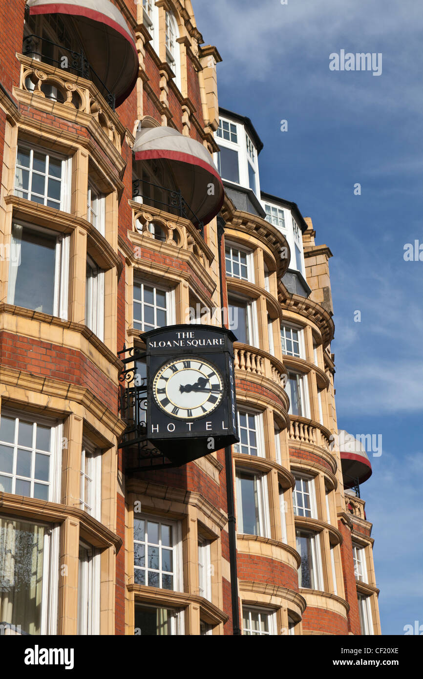 A clock projecting from the front of The Sloane Square Hotel. Stock Photo