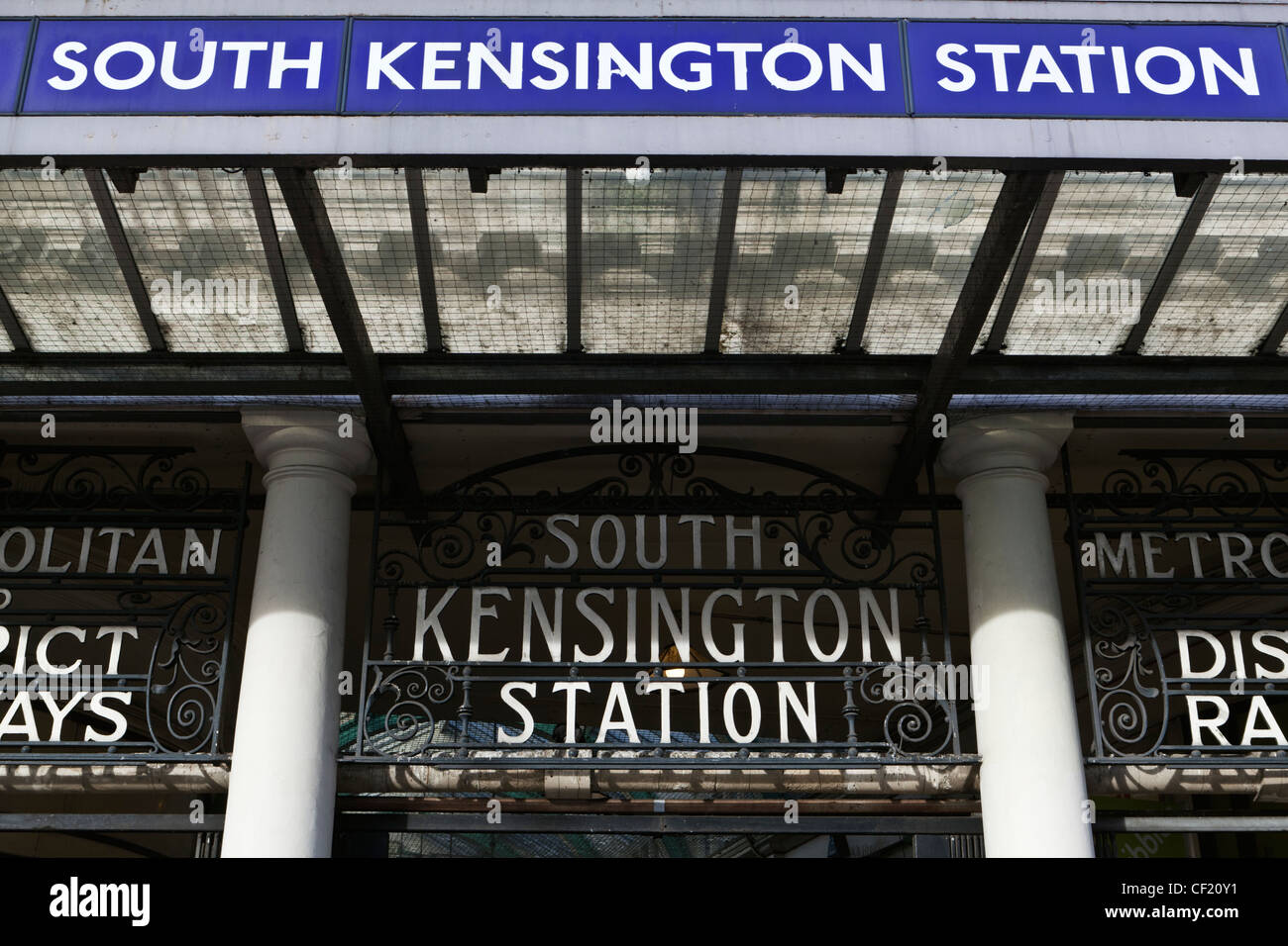 Old and modern signage outside South Kensington Underground Station in Pelham Street. Stock Photo