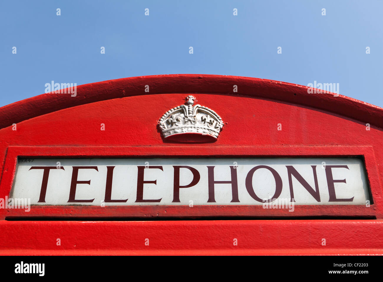 the-top-of-a-red-telephone-box-featuring-a-crown-and-the-word