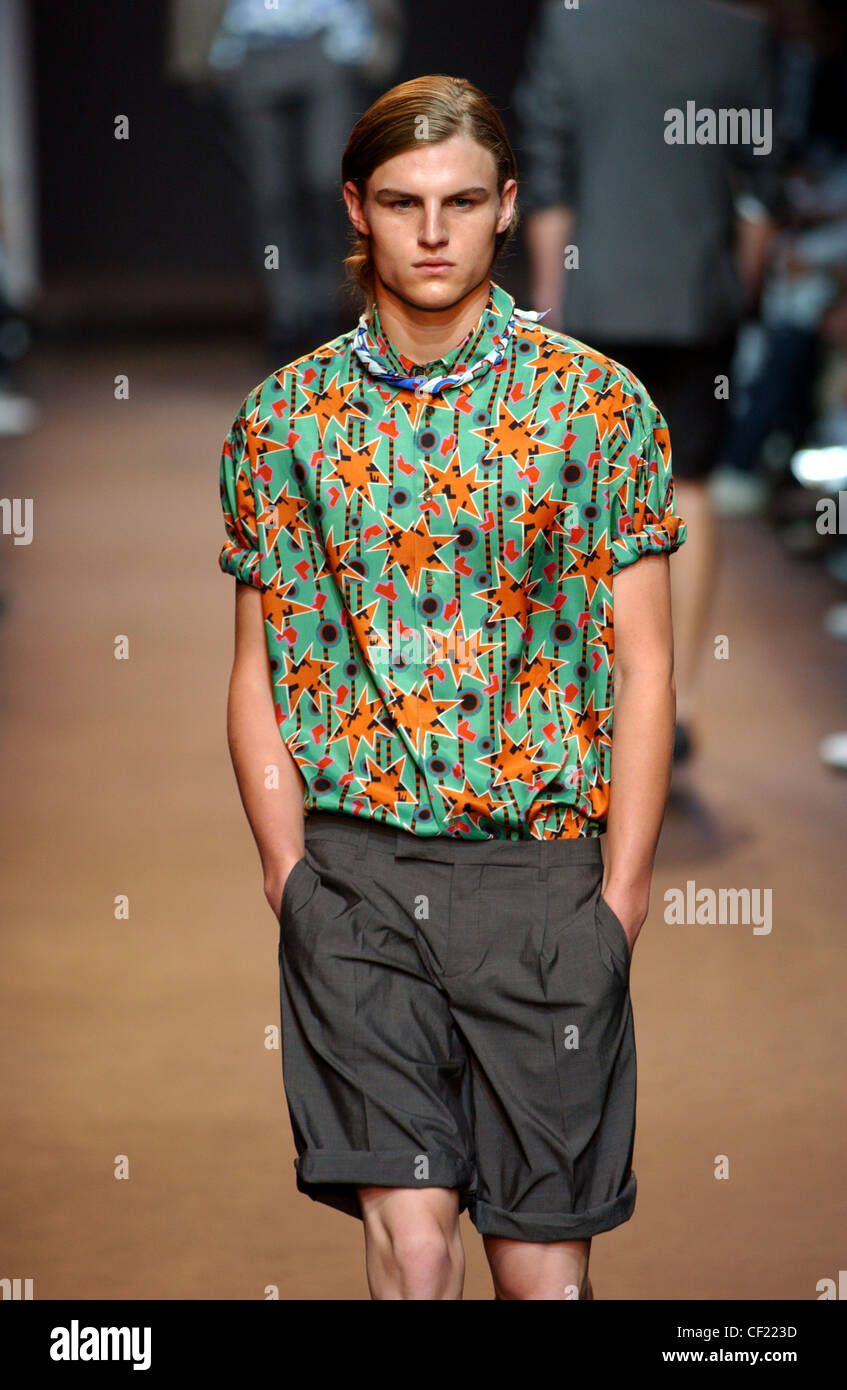 Miu Miu Milan Menswear S S Male wearing green and orange patterned shirt  rolled sleeves, and black rolled up shorts Male Stock Photo - Alamy