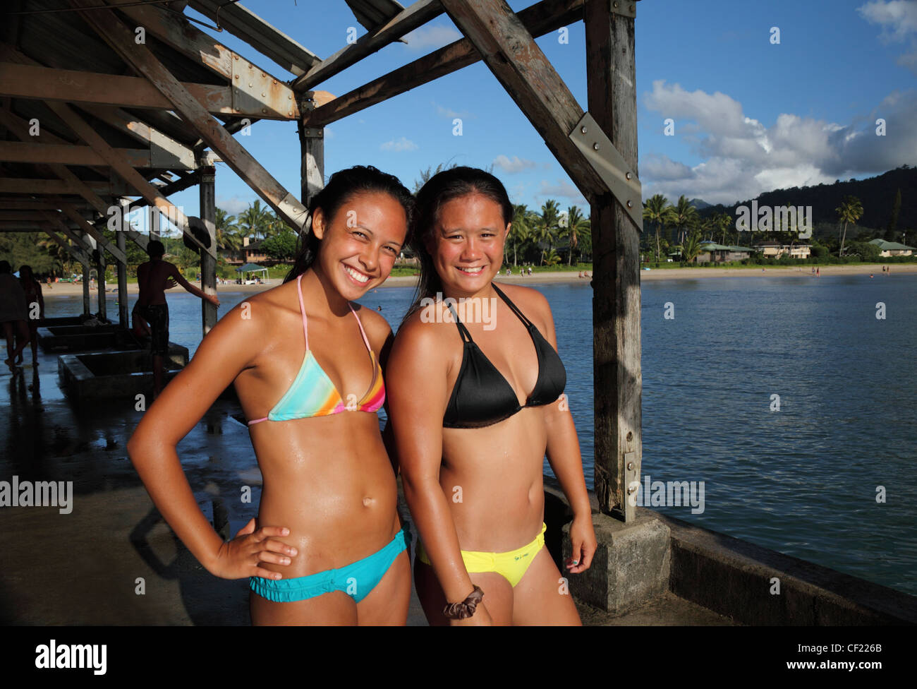 Teenagers on the Hanalei Pier on Kauai Stock Photo