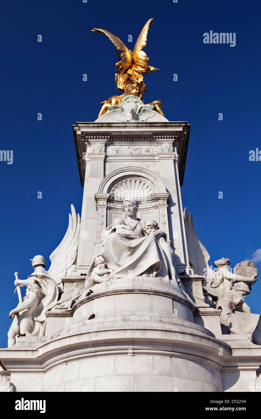 Motherhood sculpture by Sir Thomas Brock on the South-west side of the Queen Victoria Memorial outside Buckingham Palace. Stock Photo