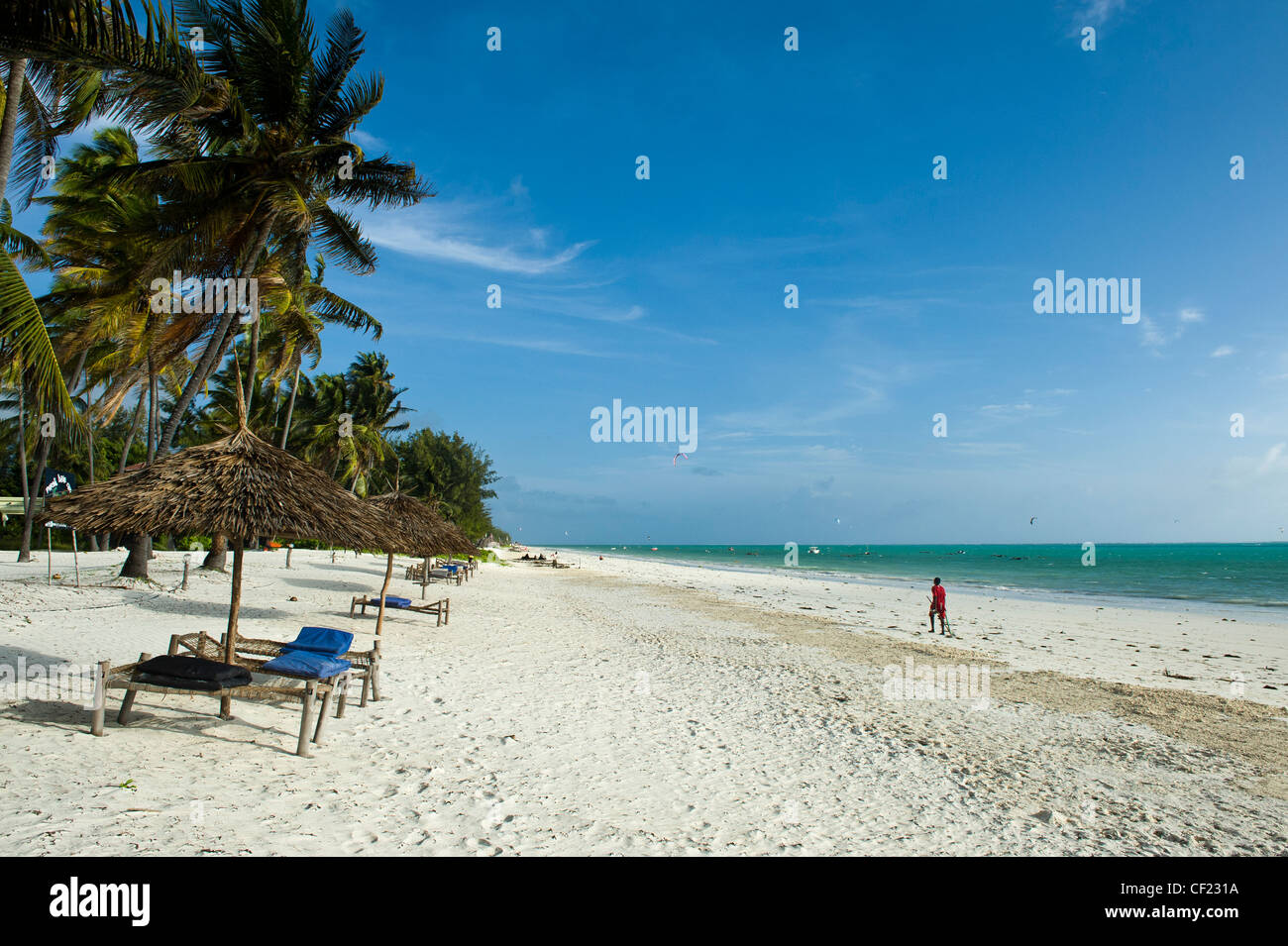 Beach umbrella with sunloungers, Paje, Zanzibar, Tanzania Stock Photo