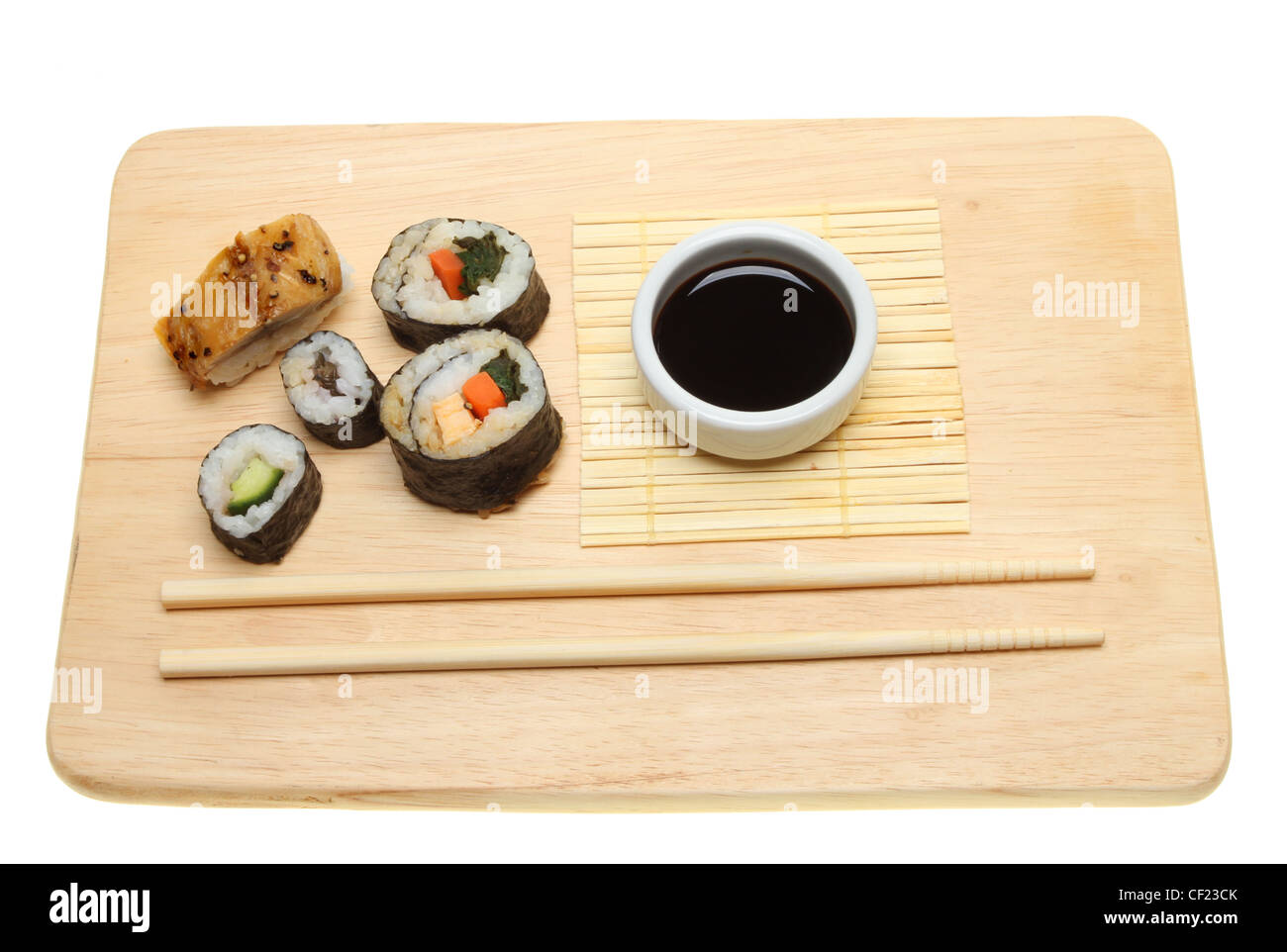 Japanese sushi, soy sauce and chopsticks on a board Stock Photo