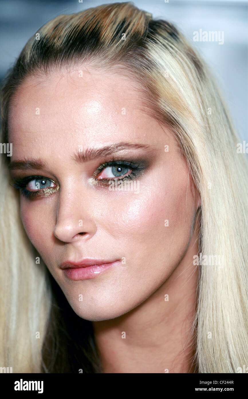 Versace Milan Backstage Spring Summer Model Carmen Kass straight blonde  hair pinned back from forehead wearing brown grey and Stock Photo - Alamy