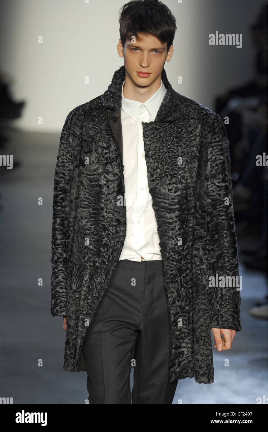Marni Milan Menswear Ready to Wear Autumn Winter Monochrome: Male model wearing charcoal sheepskin jacket over white shirt and Stock Photo