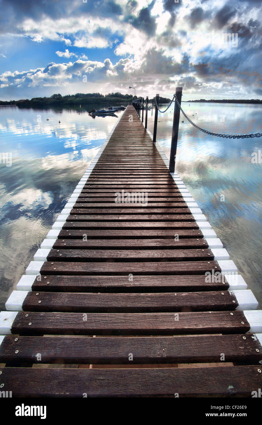 pontoon jetty stretches out into the water at yamba Stock Photo Alamy