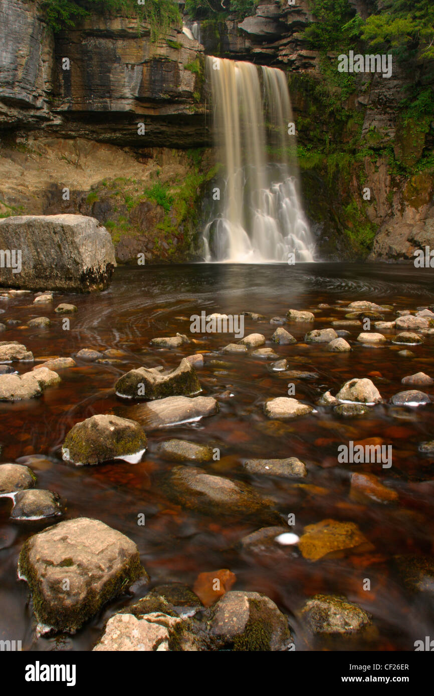 The fast flowing waters of the Thornton Force waterfall near Ingleton. Stock Photo