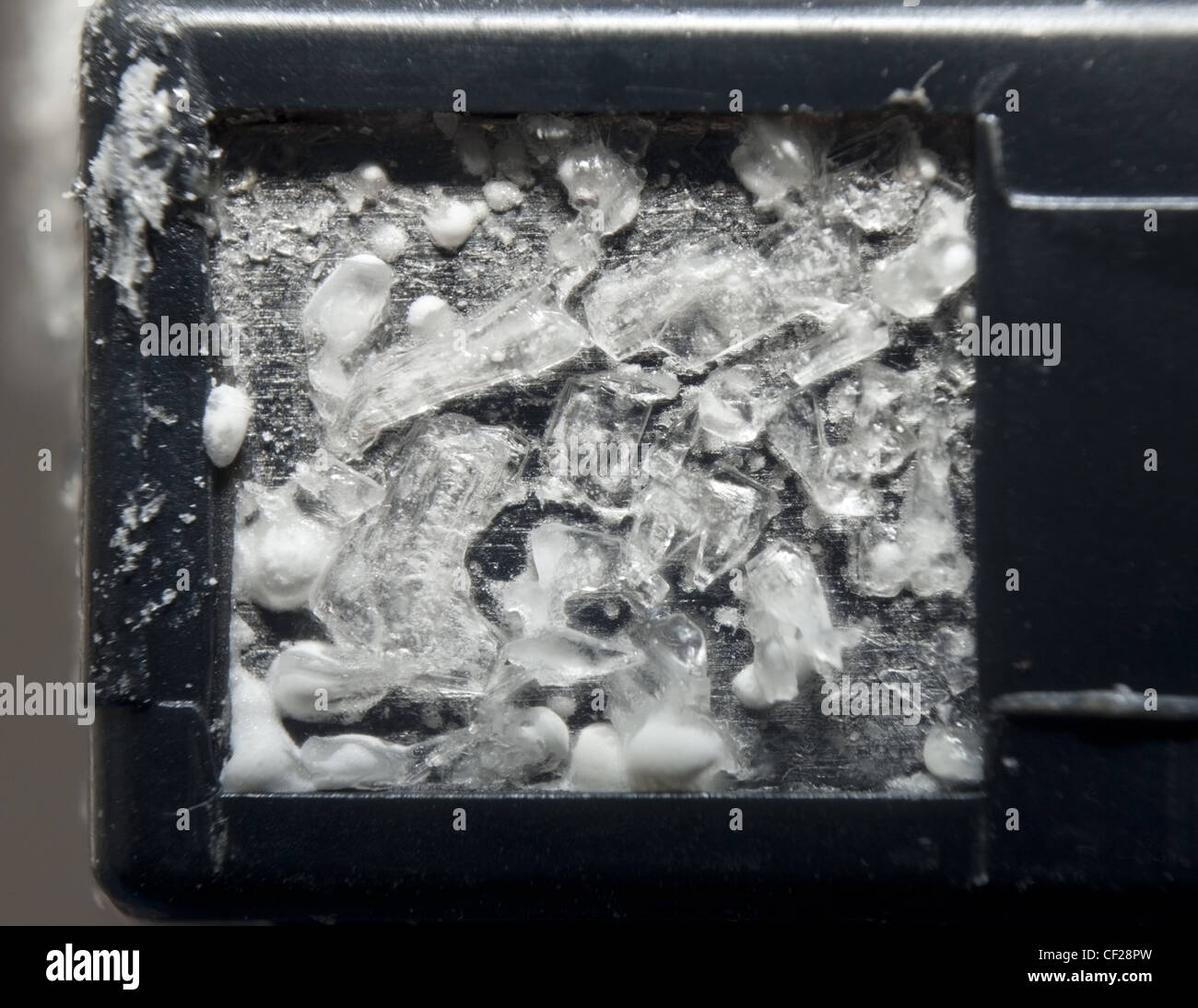 Crystals formed on the leaking contact of a lithium battery Stock Photo -  Alamy