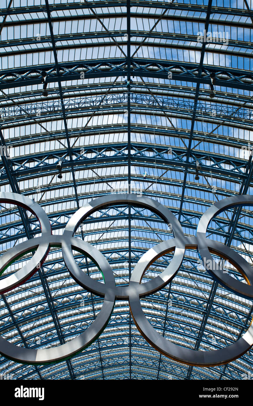 A giant set of Olympic rings suspended in St Pancras International Station to welcome visitors to London, host city of the 2012 Stock Photo