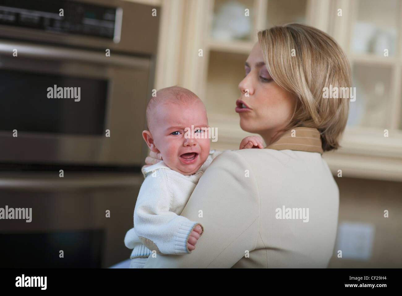 Mother Comforting Crying Baby; Jordan Ontario Canada Stock Photo