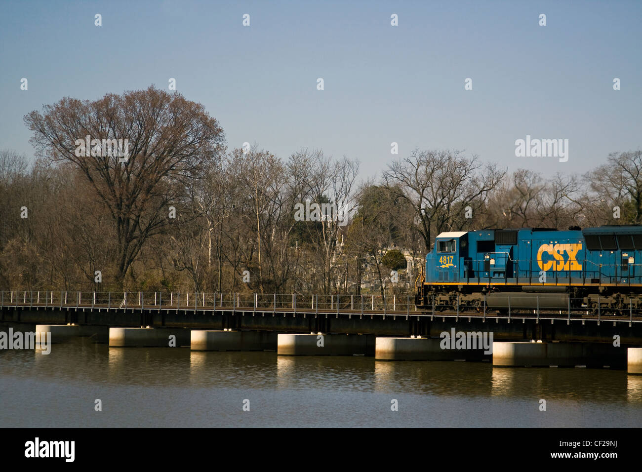 CSX locomotive 4817 on a railroad bridge crossing over the Anacostia River near Historic Congressional Cemetery in Washington DC Stock Photo