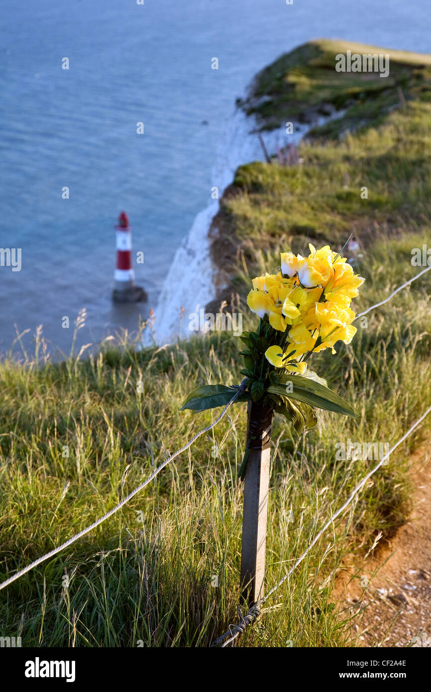 A bunch of flowers tied in rememberance of a loved one at Beachy Head