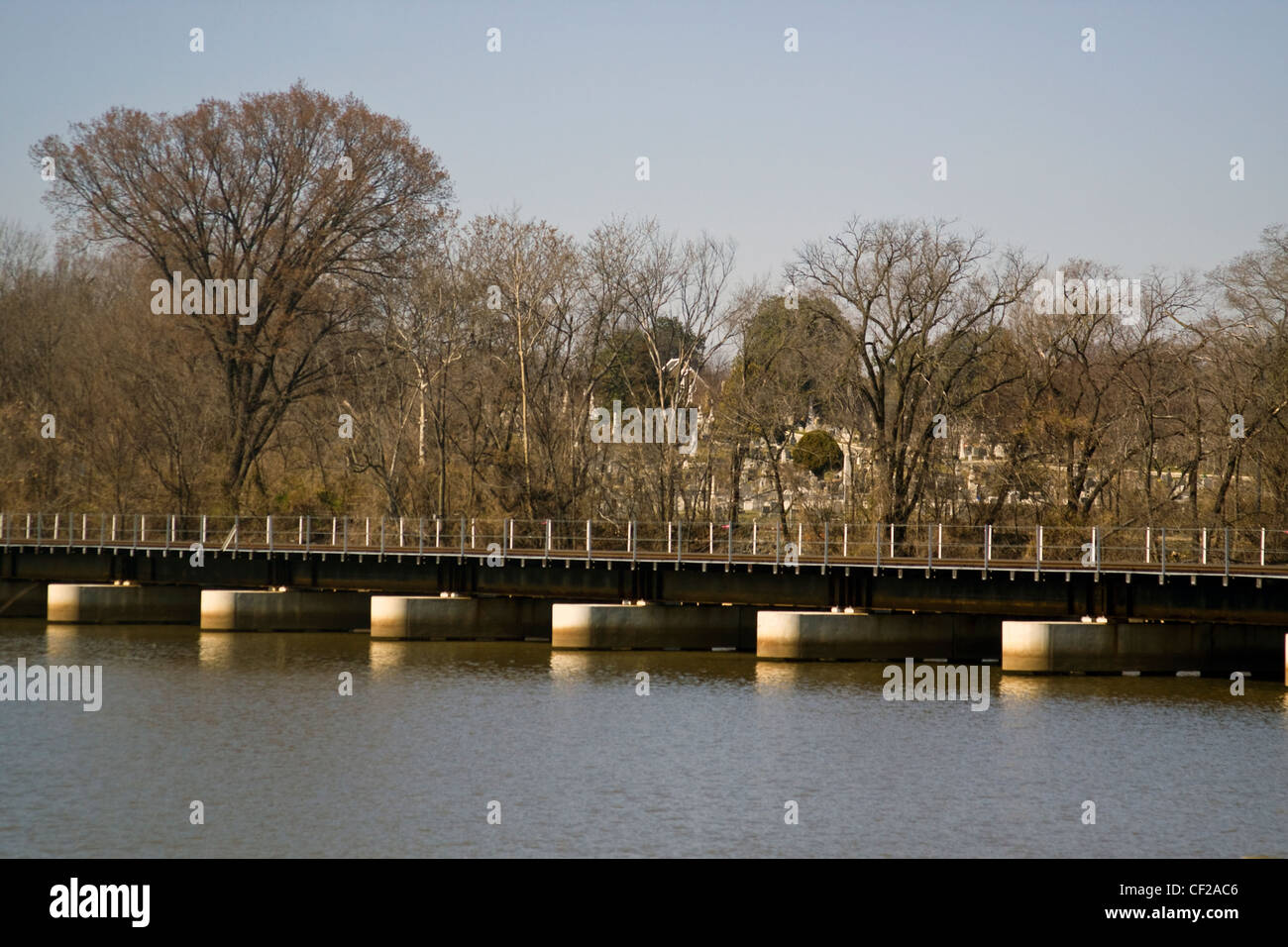 A CSX railroad bridge crossing over the Anacostia River near Historic Congressional Cemetery in Washington DC Stock Photo