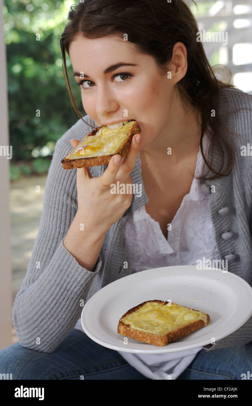 Woman Eating Cheese On Toast High Resolution Stock Photography And Images Alamy