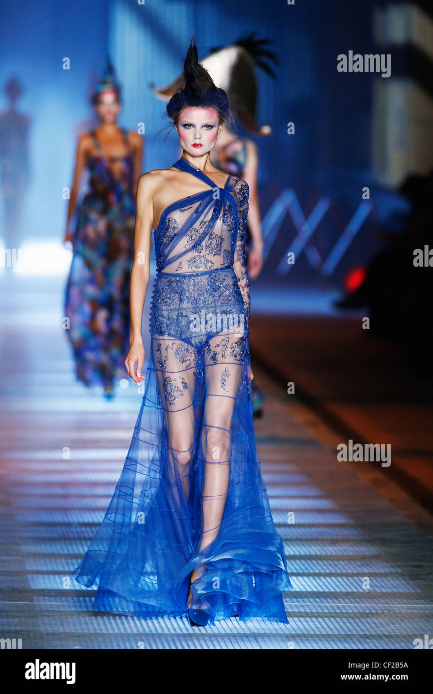 John Galliano Paris Ready to Wear Spring Summer Model wearing a sari style  see through flolength blue chiffon dress embroidery Stock Photo - Alamy