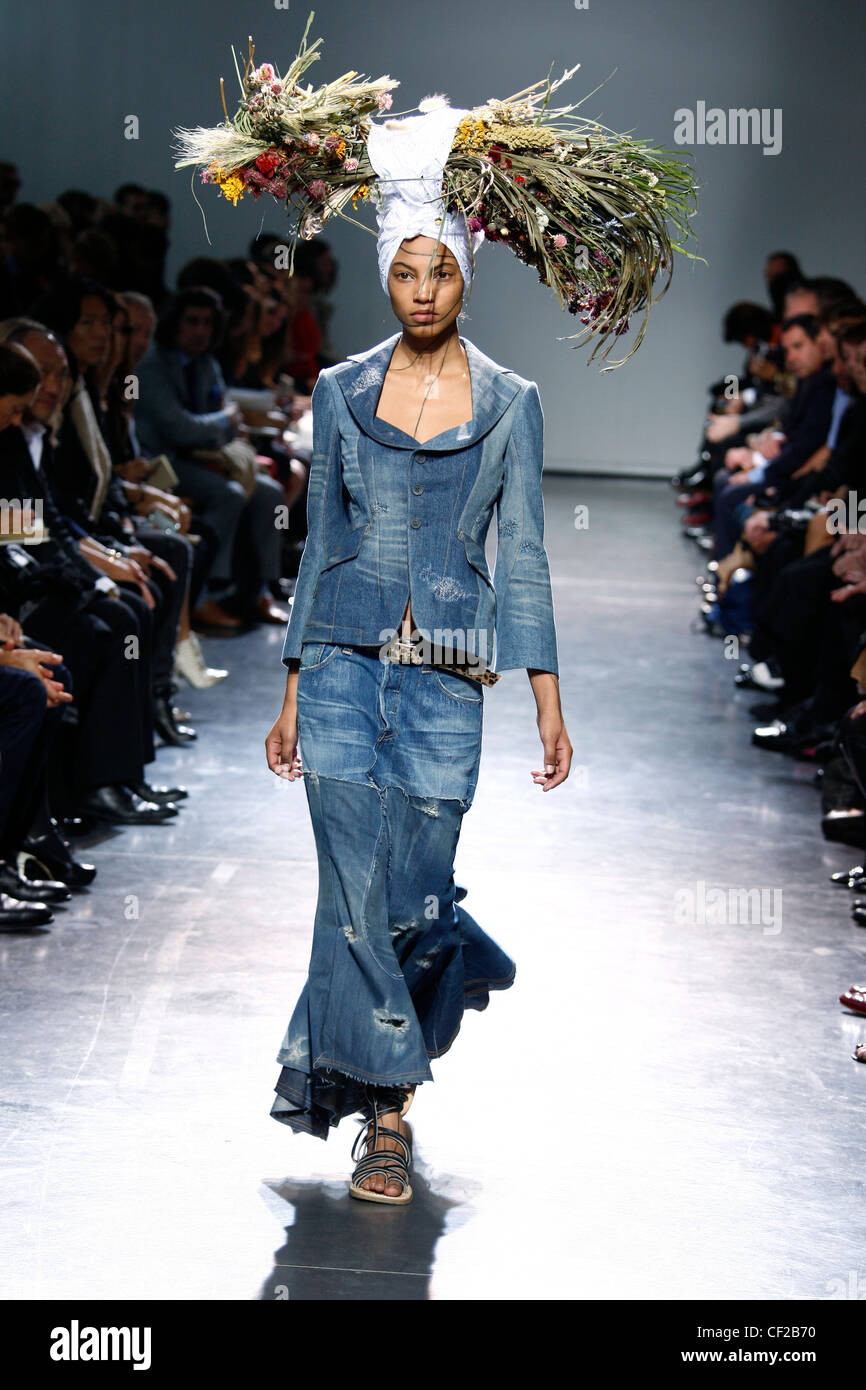 Junya Watanabe Paris Ready to Wear Spring Summer Model wearing a jeans  jacket and ankle length second hand look jeans skirt Stock Photo - Alamy