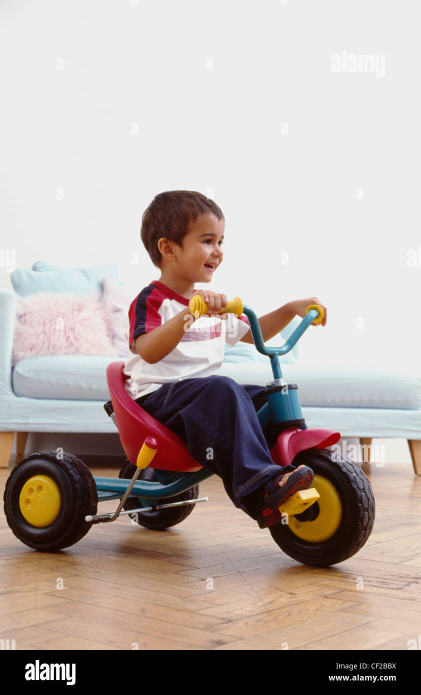 Toddler tricycle hi-res stock photography and images - Alamy