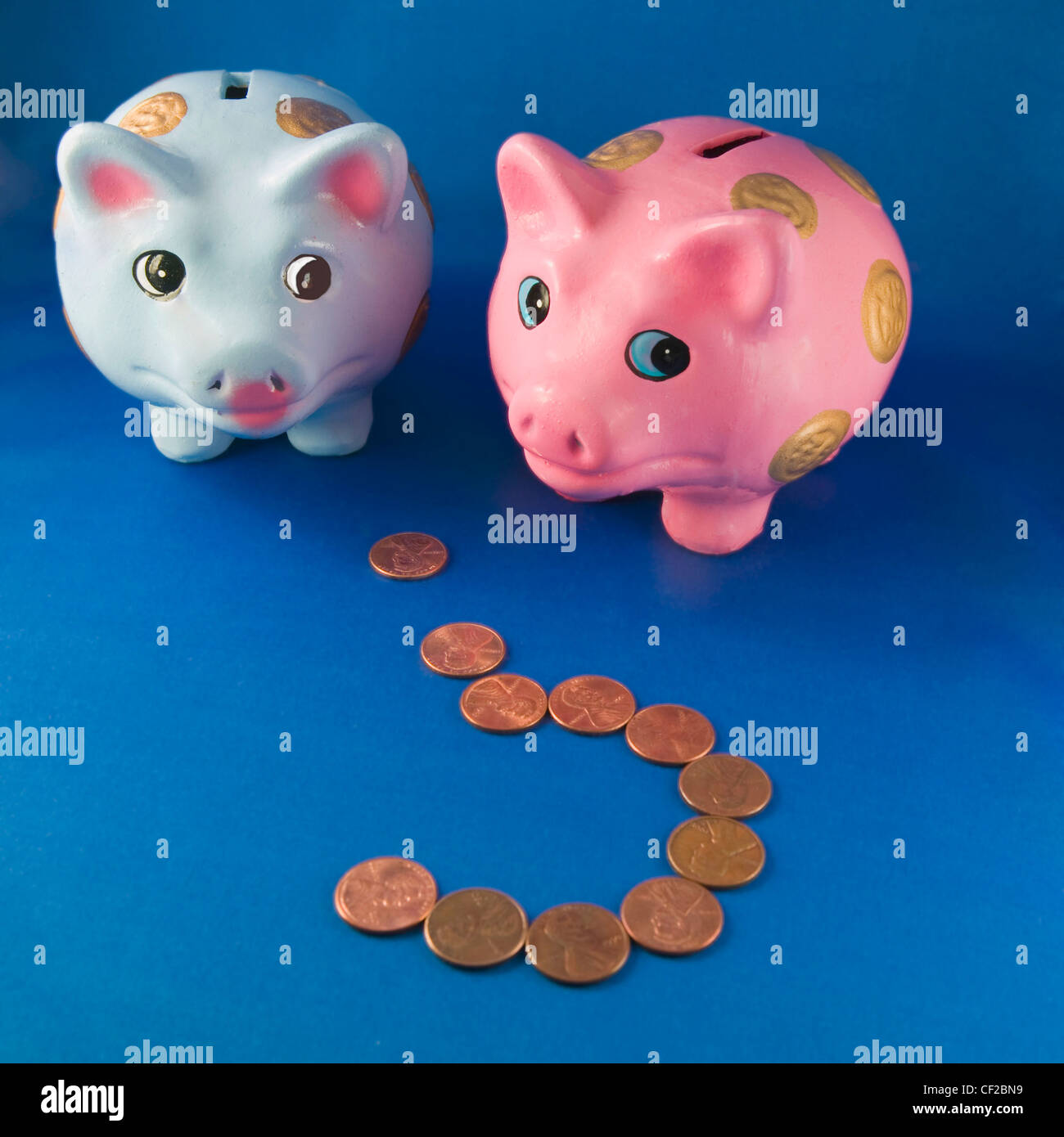 Male And Female Piggy Banks With Question Mark Made Of Pennies Stock Photo Alamy