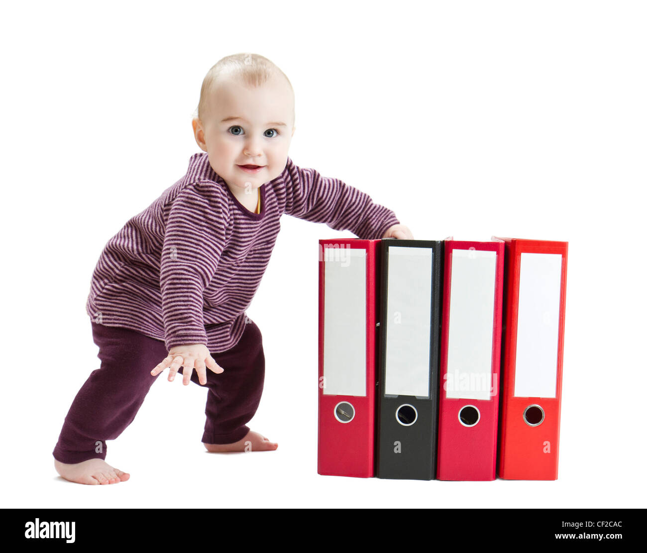 young child in light background with four ring files Stock Photo